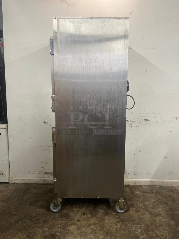ALTO-SHAAM 1000-UP full-height mobile heated cabinet, stainless steel, 8-pan capacity, on casters, in used condition.
