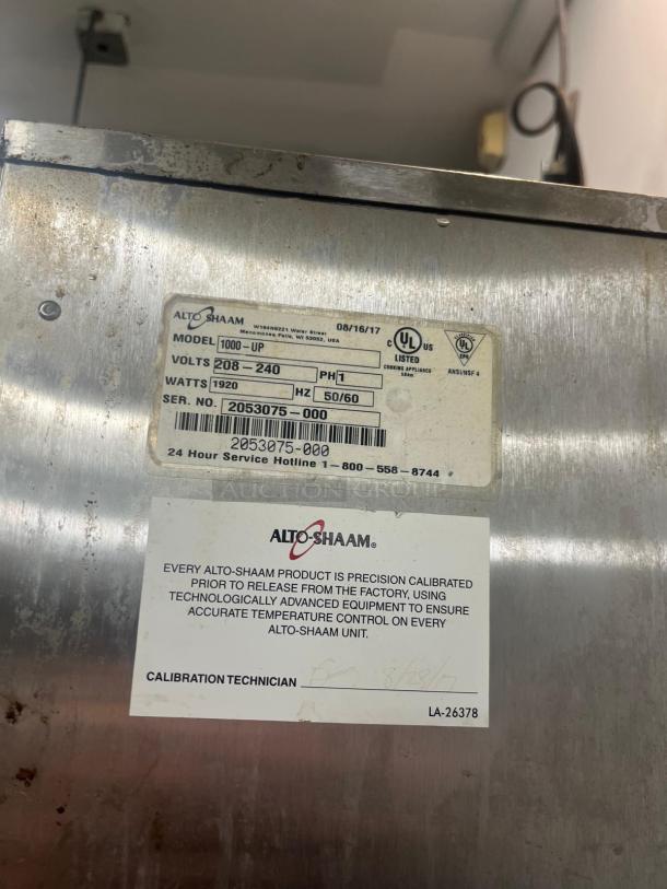 ALTO-SHAAM 1000-UP Halo Heat full-height mobile heated cabinet, 8-pan capacity, 120V, calibration label visible.