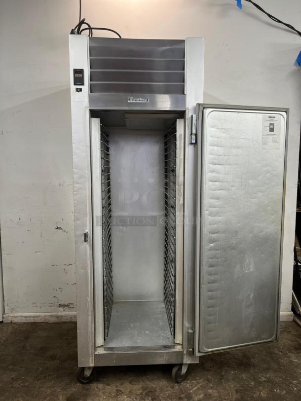 TRAULSEN G10010 30" solid door reach-in refrigerator, right hinged, stainless steel, visible interior racks, used condition.