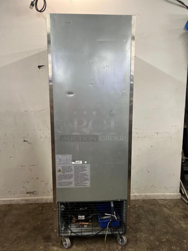 Traulsen G10010 30" reach-in refrigerator, right-hinged door, visible wear, features safety and model labels.