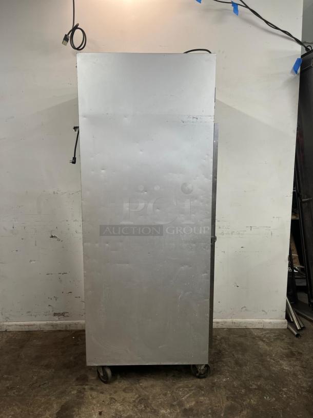 Traulsen G10010 30" G Series solid door reach-in refrigerator, right hinged, industrial-grade, stainless steel, visible wear.
