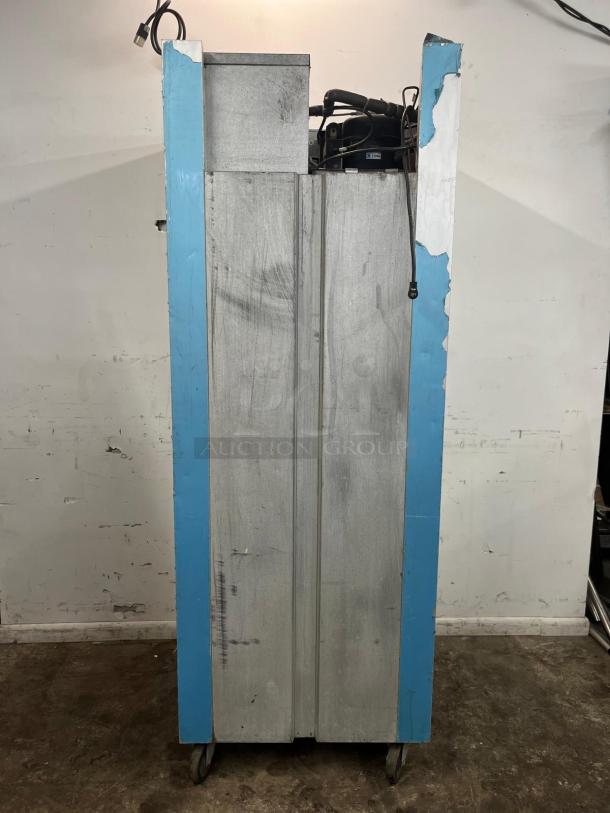 NICE TRAULSEN G10010 30" G Series solid door reach-in refrigerator, right-hinged, visible wear on exterior, mounted on casters.