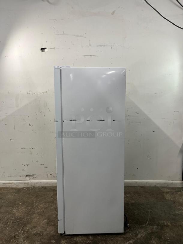 INSIGNIA 7 Cu. Ft. Upright Convertible Freezer, model NS-UZ70WH4, in good condition, converts to fridge, energy-efficient.