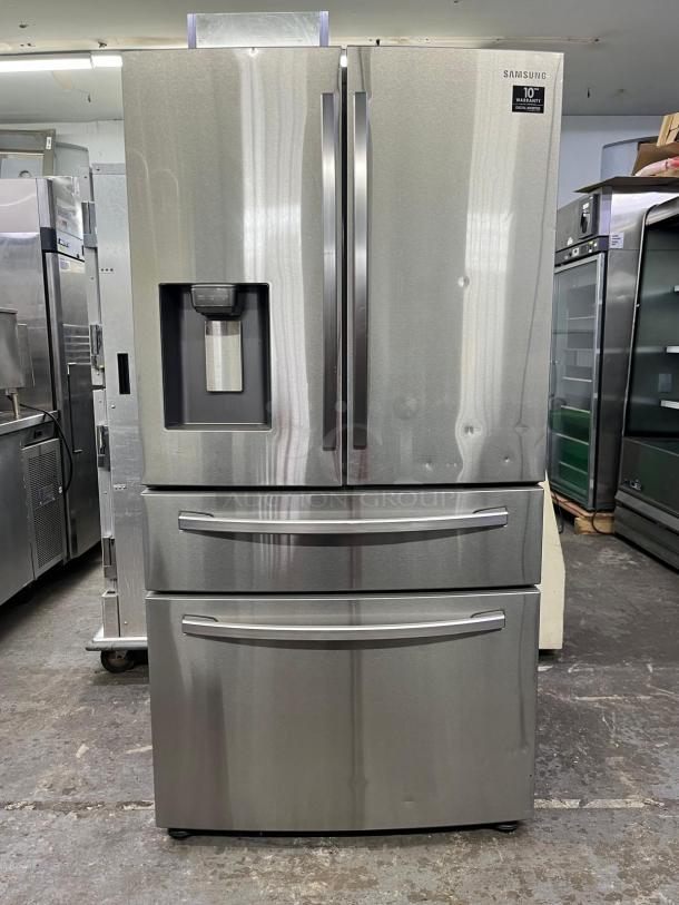Brand new open box 36" Samsung French Door Refrigerator, model RF28R7201SR, with water dispenser and warranty label.