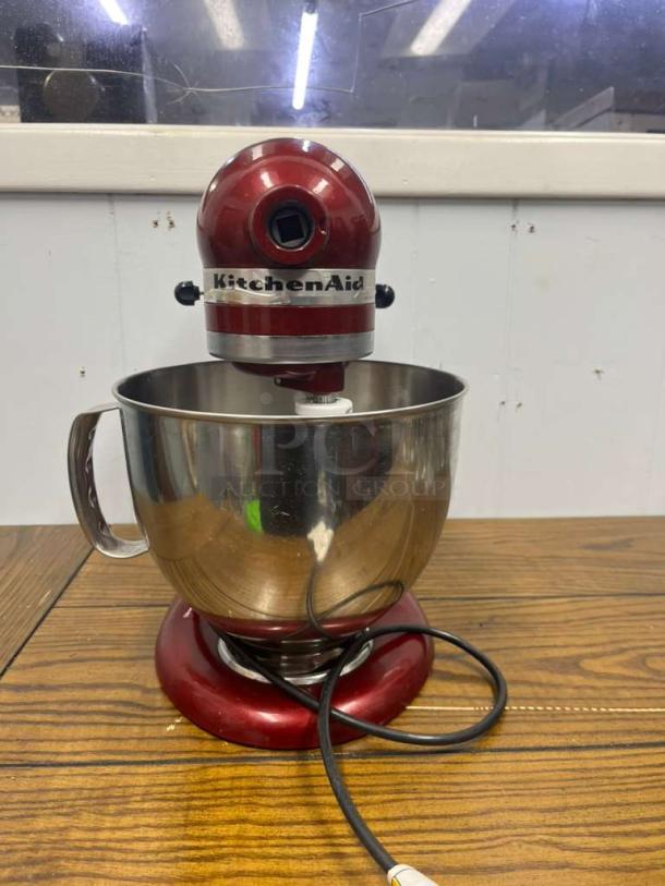 KitchenAid Artisan 5 Qt Tilt-Head Stand Mixer, model KSM150PS, in Empire Red. Visible wear, includes stainless steel mixing bowl.