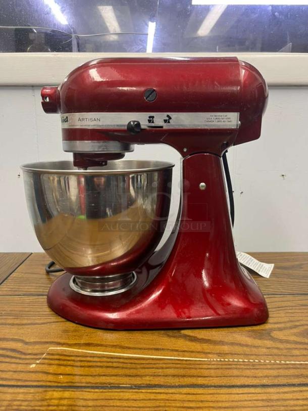 KitchenAid Artisan Series 5 Quart Tilt-Head Stand Mixer, model KSM150PS, in Empire Red. Slight wear, comes with stainless steel bowl.