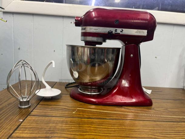 KitchenAid Artisan Series 5 Quart Tilt-Head Stand Mixer in Empire Red, model KSM150PS. Includes whisk and dough hook.