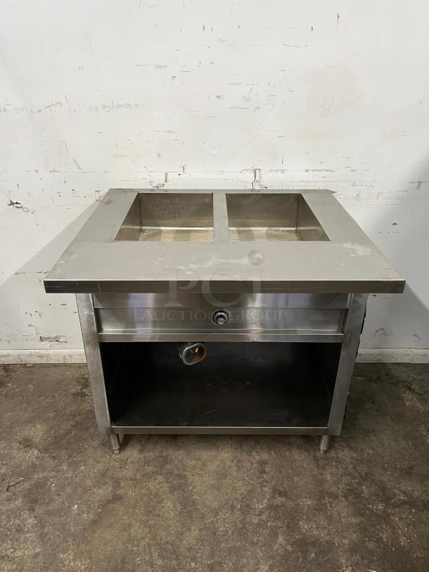 24" electric steam table, stainless steel, dual compartments, open storage below, good condition, ideal for catering.