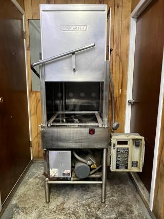 HOBART AM14 commercial dishwasher, stainless steel, model AM14. Visible control panel, used condition. Suitable for heavy-duty use.