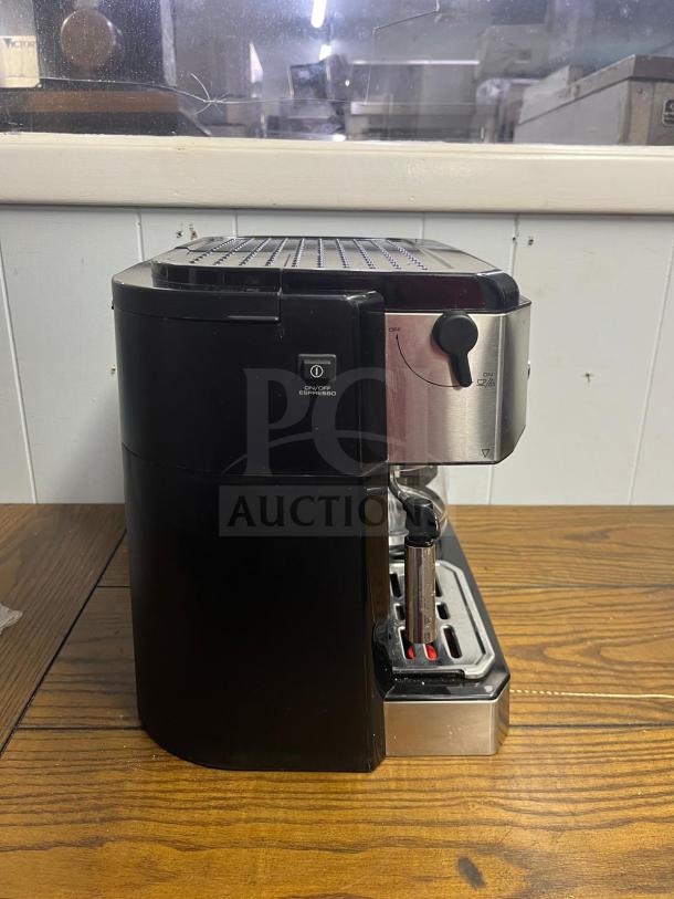 DE LONGHI BCO430 coffee machine, silver and black, combines espresso and 10-cup drip functions, features frothing wand.