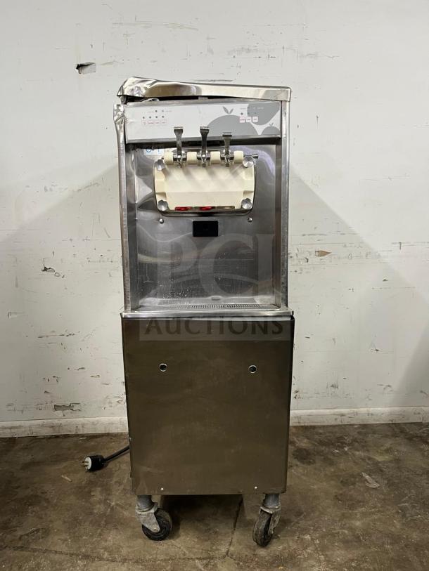 TAYLOR 794-33 soft serve ice cream machine, stainless steel, used condition, with visible control panel and dispensing levers.