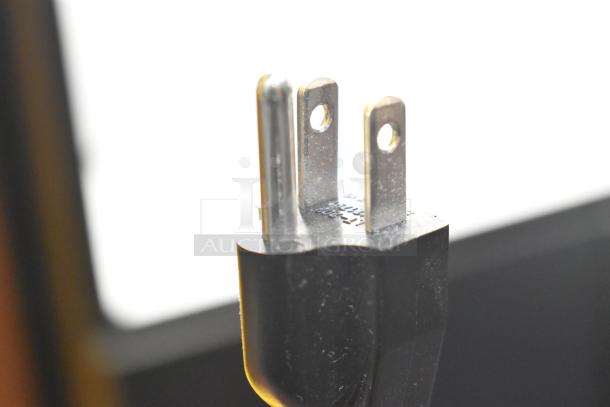 Plug of Elma Elmasolvex RM Cleaning Machine, 115-120V, 1 Phase; close-up view, showing prongs and markings.