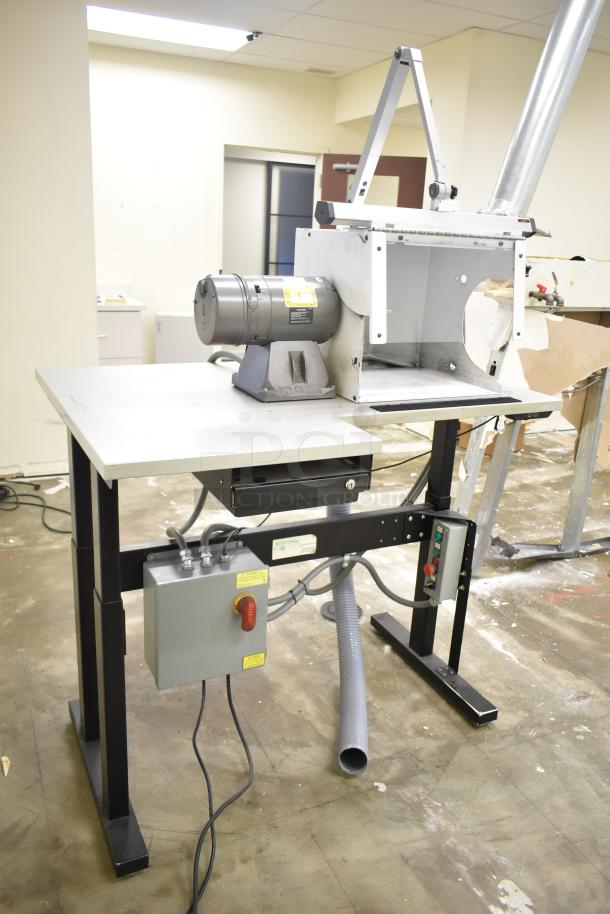 Baldor enclosed suction polishing machine with foot pedal. 208-230/460 volts, 3 phase. Includes control panel and hose.