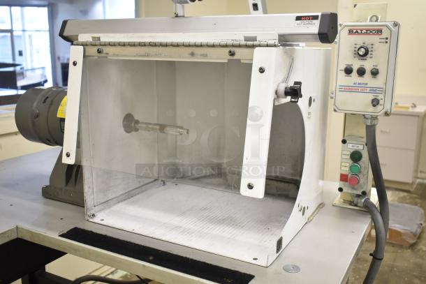 Baldor enclosed suction polishing machine with foot pedal, 208-230/460V, 3 phase, washdown duty drive, control panel visible.