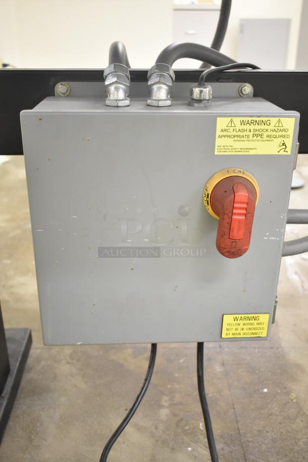 Baldor enclosed suction polishing machine, 208-230/460V, 3-phase, with foot pedal. Visible warning labels on control box.