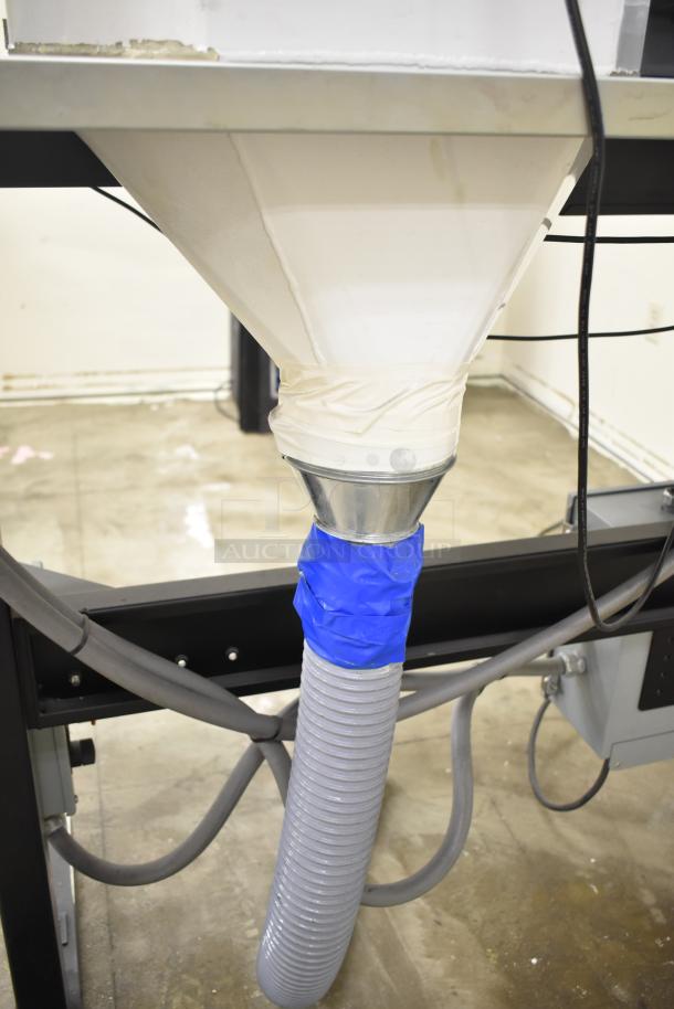 Baldor enclosed suction polishing machine with foot pedal, 208-230/460 volts, 3 phase, shown with connected hose and wiring.