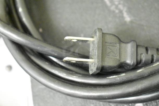 Close-up of a power plug for the Quatro Air Technologies PGR-21 dust collector, 100-120V, 1 phase.