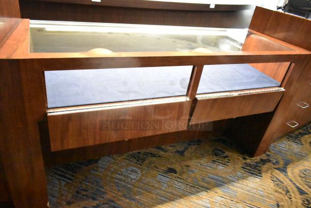 Wooden jewelry merchandising display case, glass top, rich brown finish, brass hardware, excellent condition, spacious interior.