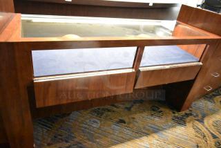 Wooden jewelry merchandising display case, glass top, rich brown finish, brass hardware, excellent condition, spacious interior.