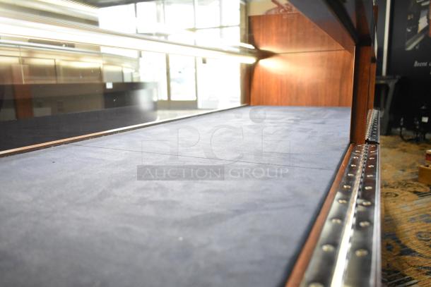 Wooden jewelry merchandising display case with glass top, blue velvet interior, and metal trim. Excellent condition.