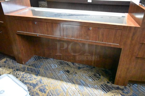 Wooden jewelry merchandising display case with glass top, lockable drawers, and rich wood finish; excellent condition.