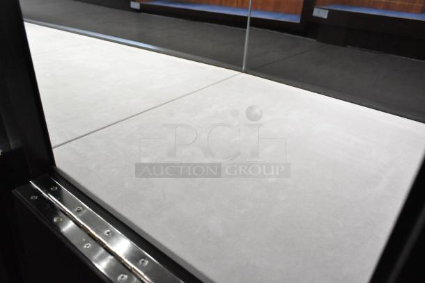 Wooden jewelry display case with glass top; minimalistic design, excellent condition, ideal for merchandising.