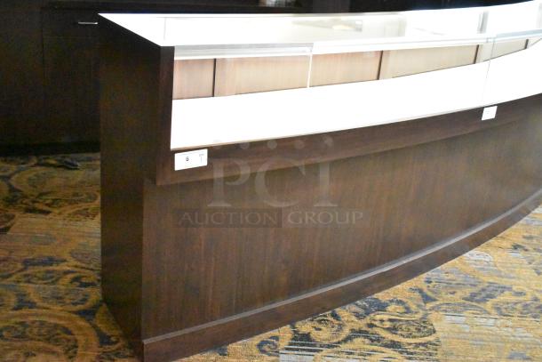 Wooden jewelry merchandising display case with glass top and curved dark wood front. Excellent condition, tag indicates quantity 1.