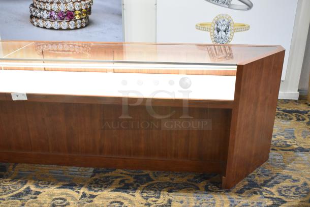Wooden corner jewelry display case with glass top, two rear drawers, excellent condition, ideal for merchandising.