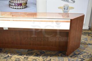 Wooden corner jewelry display case with glass top, two rear drawers, excellent condition, ideal for merchandising.