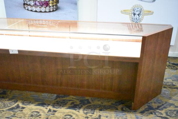 Wooden corner jewelry display case with glass top, two rear drawers, and key lock. Suitable for showcasing and retail use.