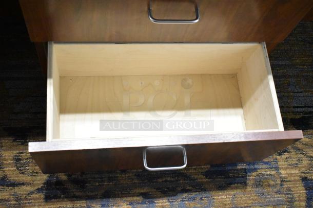 Wooden corner jewelry display case with two rear drawers, open drawer showing light wood interior, metal handles visible.