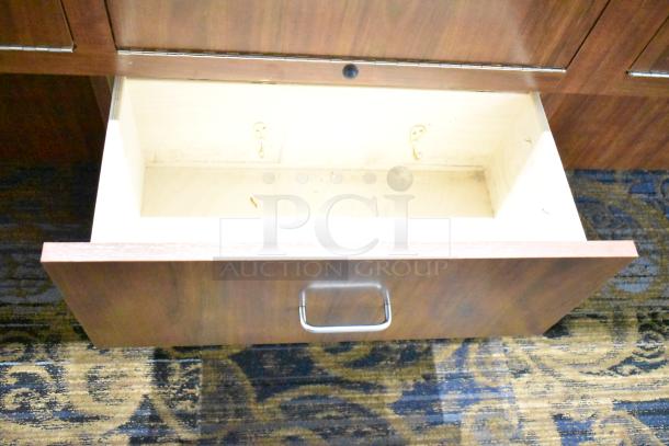 Wooden corner jewelry display case with open rear drawer, metal handle, and light wear. Ideal for merchandising.