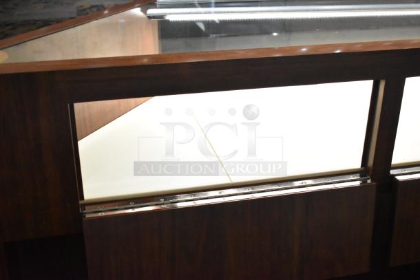 Wooden corner jewelry display case with glass top, 2 rear drawers, excellent condition. Suitable for store merchandising.