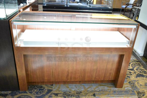 Wooden corner jewelry display case with glass top, two rear sliding doors, in excellent condition.
