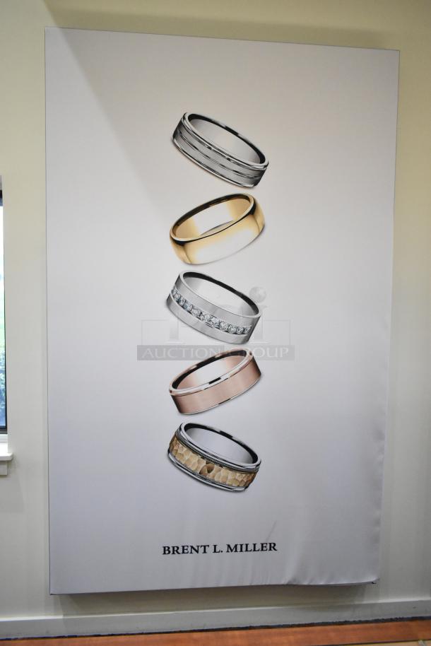 SEG Systems Wall Mount Lighted Picture Mount, featuring ring designs, 110-277 volts, "Brent L. Miller" displayed.