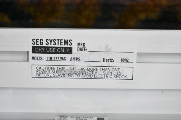 SEG Systems LB-EDG-6D-W6-24 Wall Mount Lighted Picture Mount. Label indicates 110-277 VAC, 60Hz. Dry use only.