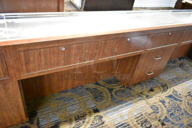 Lighted wooden jewelry display case with two drawers, glass top, excellent condition, ideal for retail showcasing.