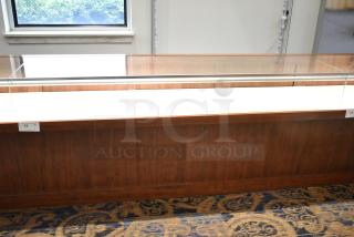 Lighted wooden jewelry display case with glass top, two drawers, cherry finish, excellent condition, tags show item number 15.