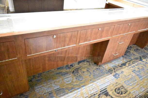 Lighted wooden jewelry display case, two drawers, glass countertop, rich wood finish, ideal for merchandising, excellent condition.