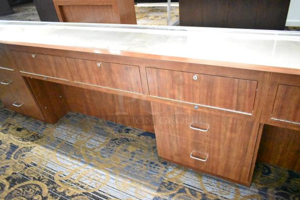 Lighted wooden jewelry merchandising display case with two drawers, glass top, secure locks, excellent condition.