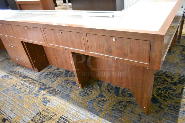 Lighted wooden jewelry display case with glass top, multiple storage drawers, and a polished finish. Ideal for retail use.