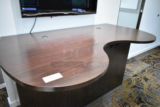 Wooden counter with 4 doors, dark wood finish, curved edge design, modern style, in excellent condition with two cable holes.