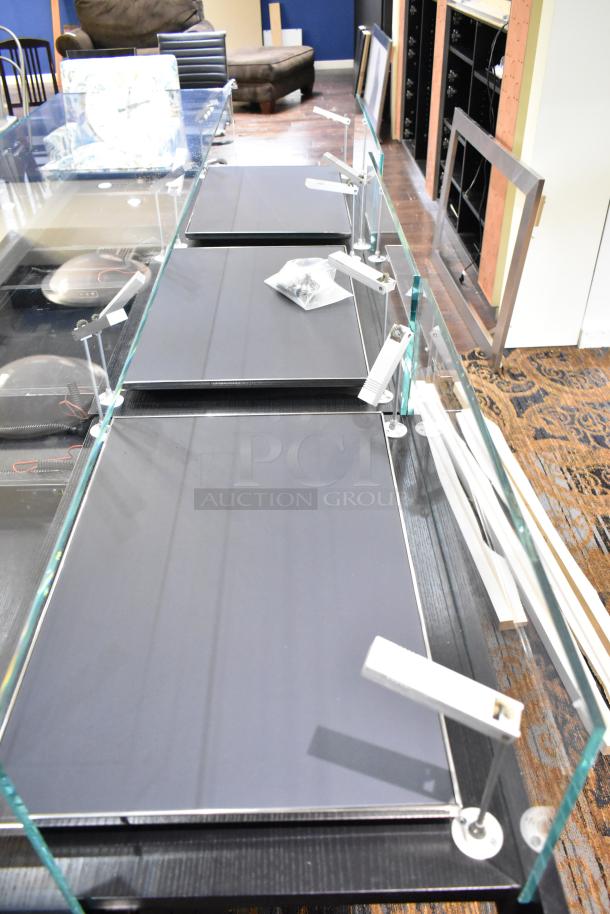 Jewelry case with 6 rear drawers, glass top, metal supports. Buyer must remove; bring tools and manpower for disassembly.