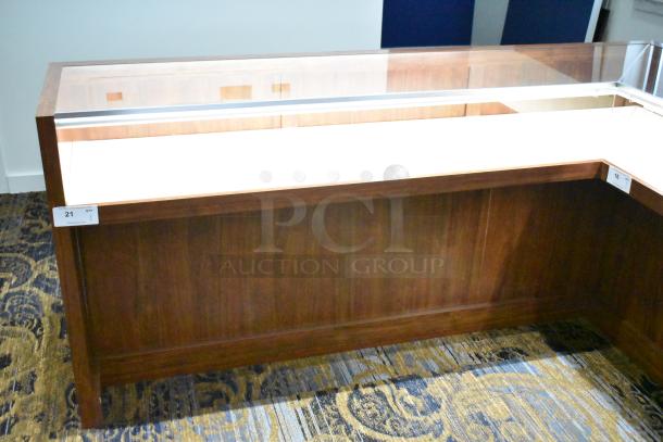 Wooden lighted jewelry case with glass top and two rear doors, excellent condition. Buyer must bring tools for removal.