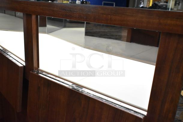 Wooden lighted jewelry case with four rear doors, white display surface, must remove with tools and manpower.