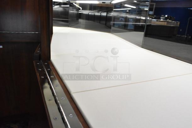 Wooden lighted jewelry case, four rear doors, polished wood finish. Buyer must remove. Bring tools and manpower.