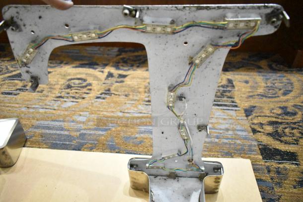 White "L" letter with silver finish frame, features internal wiring and LED strips, overall good condition.