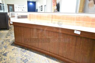 Lighted wooden jewelry display case with glass top, two rear sliding doors, excellent condition; buyer must remove.