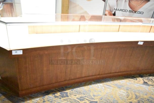 Lighted wooden jewelry display case with glass top, two rear sliding doors, in good condition. Buyer must remove.