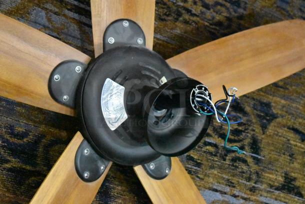 48-ATR Ceiling Mount 5 Blade Fan, 120 Volts, 1 Phase. Features wood-tone blades. Visible wiring and mounting components.